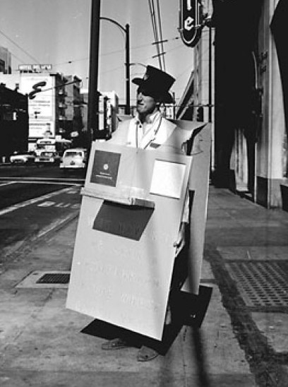 Stewart in his button-selling sandwichboard, 1967